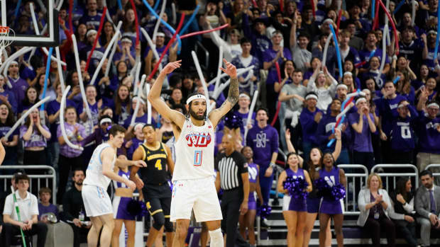 Northwestern Wildcats guard Boo Buie (0) gestures after making a three point basket against the Michigan Wolverines during the first half at Welsh-Ryan Arena.
